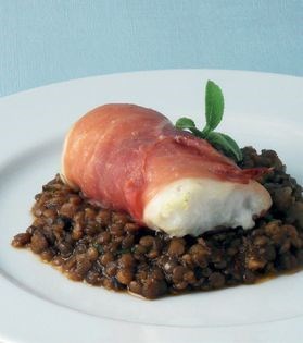 Cod wrapped in ham with sage and onion lentils