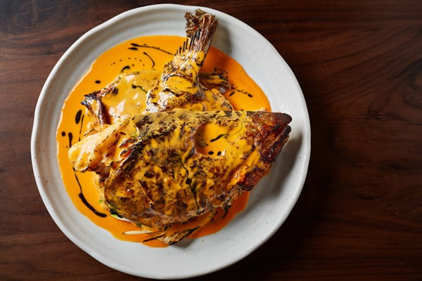 Cod’s head with sriracha butter sauce