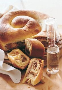 Coiled yeast coffee bread with nut filling (Gubana)