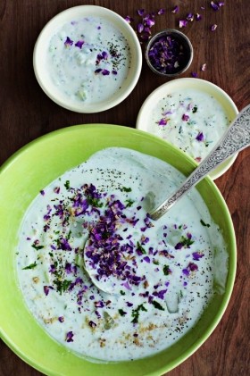 Cold cucumber soup with plump raisins, walnuts, mint and spring onions