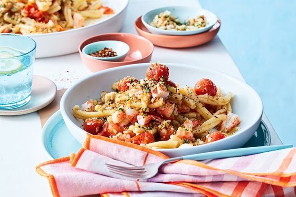 Confit cherry tomato and garlic prawn pasta with basil pangrattato