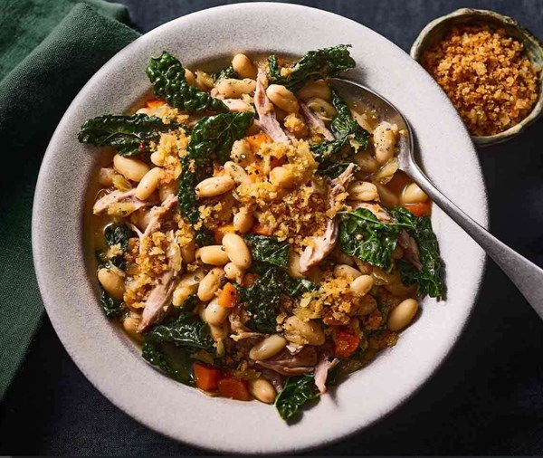 Confit duck with beans & cavolo nero