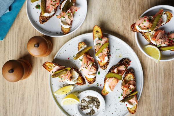 Confit salmon on toast, creme fraiche, cornichon