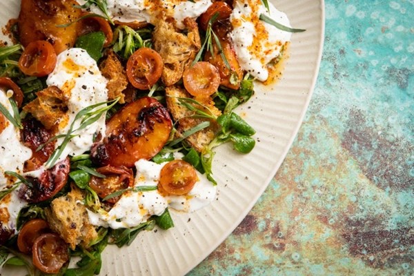 Confit tomato, grilled peach and stracciatella salad