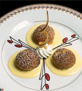 Cookie-crusted profiteroles with nougat sauce