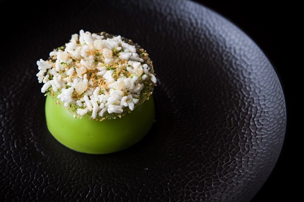 Coriander and white chocolate dome, mango sorbet, coconut espuma, sweet puffed rice