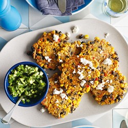 Corn and black bean fritters with green salsa and feta