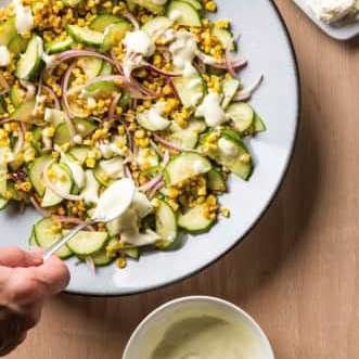 Corn and cucumber salad with red bell pepper and cilantro