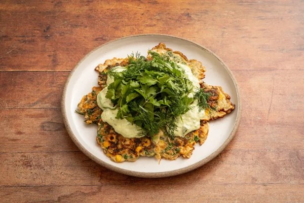 Corn and mixed herb fritters with tahini-yogurt sauce