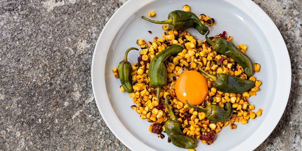 Corn and 'nduja with pickled Padrón peppers and egg yolk