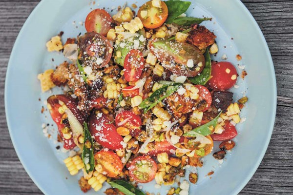 Corn and tomato salad with torn croutons