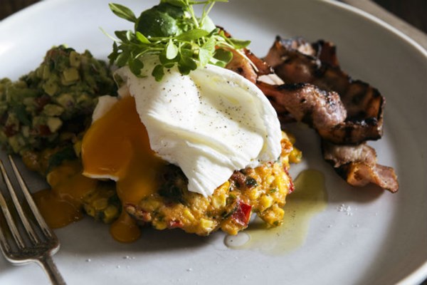 Corn cakes with grilled bacon, avocado salsa and poached eggs
