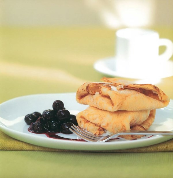 Corn crêpes with blueberry sauce and vanilla bean ice cream