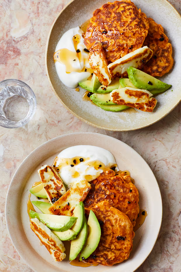 Corn fritters with avocado, halloumi and hot honey