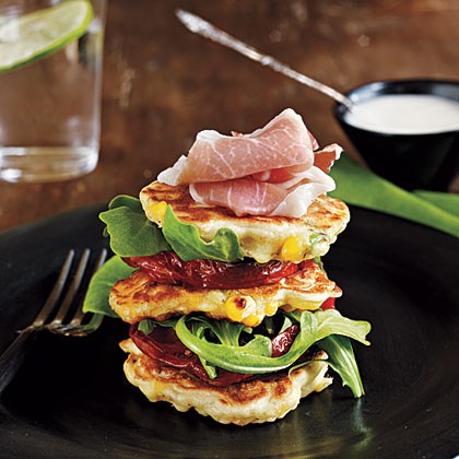 Corn fritters with roasted tomatoes and lime aioli