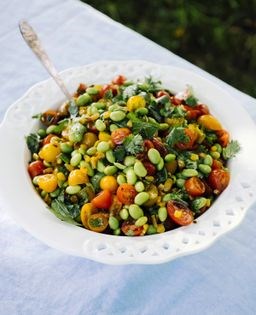Corn kernel salad with soybeans, cherry tomatoes, and basil