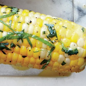 Corn on the cob with orange, tarragon, and basil butter