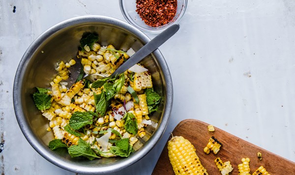 Corn salad with hazelnuts, pecorino, and mint