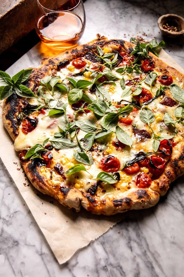 Corn tomato and bacon goat cheese pizza