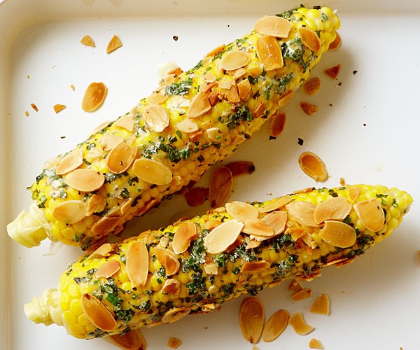 Corn with lemon, herbs, mascarpone, and almonds