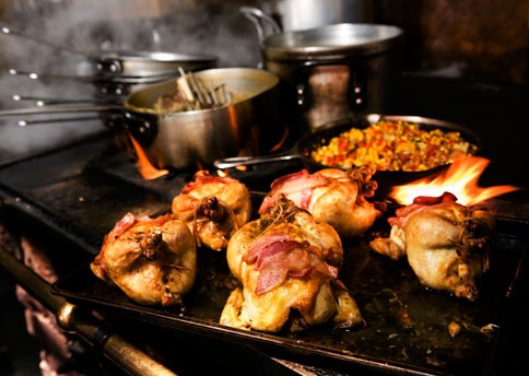 Cornbread-stuffed Cornish game hens with corn maque choux