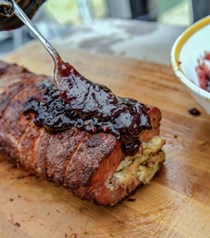 Cornbread-stuffed pork loin with raspberry chipotle sauce [Smokin' Hoggz]