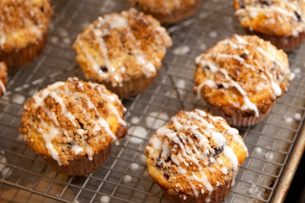 Cornmeal lemon blueberry muffins with streusel topping and lemon glaze