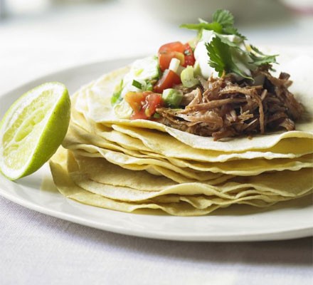 Cornmeal pancakes with spiced pork and avocado salsa