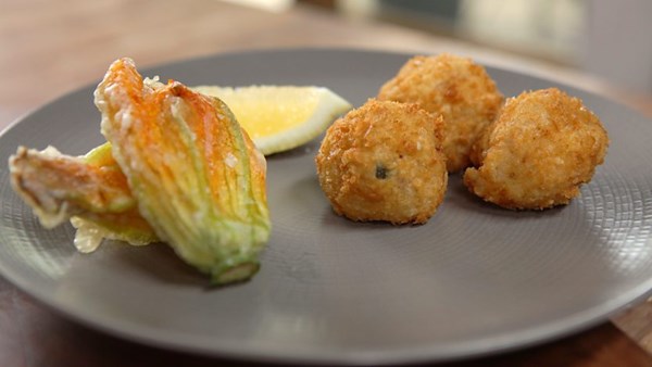 Courgette and lemon arancini with deep-fried courgette flowers