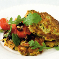 Courgette fritters with lemon and olive salsa