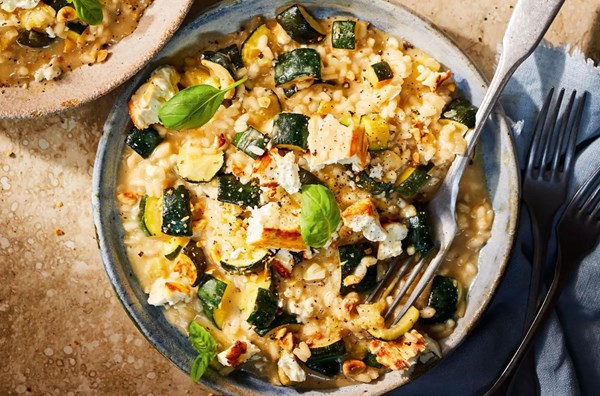 Courgette risotto with baked feta & hazelnuts