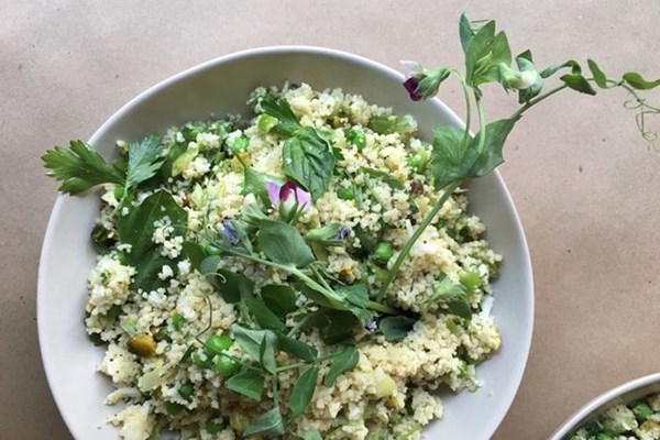 Couscous with peas, leeks, haloumi, pistachios & fresh herbs