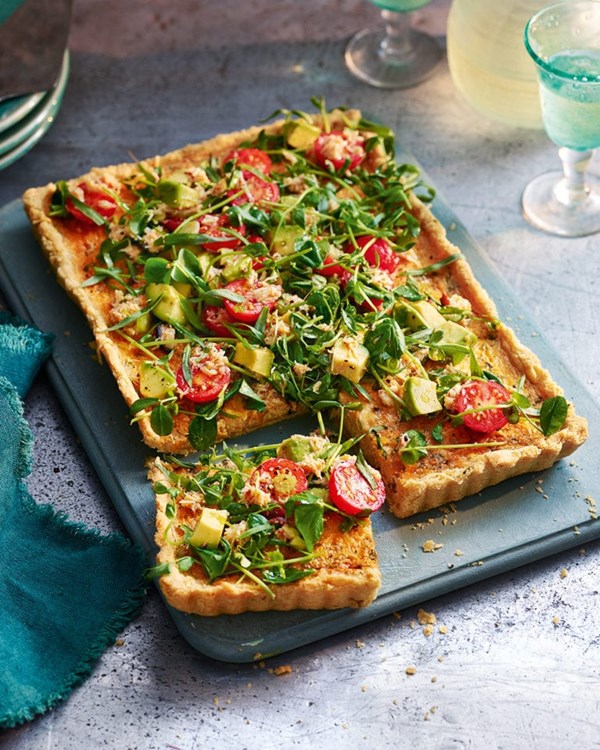 Crab and Gruyère tart with pea shoot and avocado salad