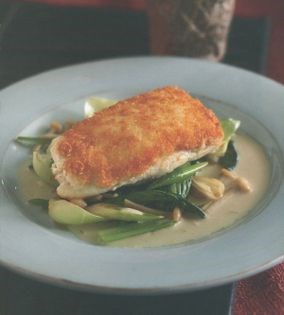 Crab, ginger and tofu-crusted halibut on wok-fried greens with red lentil coconut broth