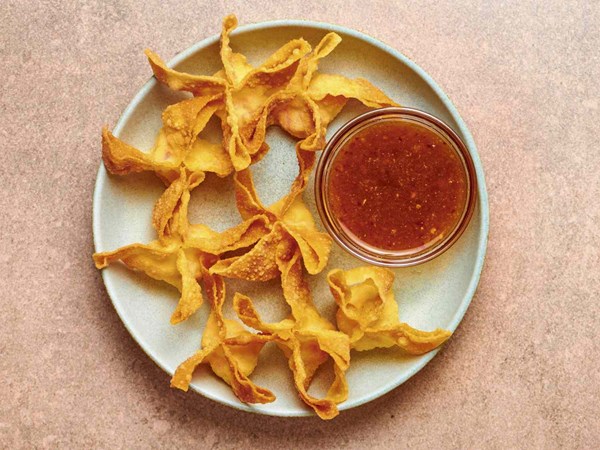 Crab puffs with sweet and sour sauce (Crab Rangoon)