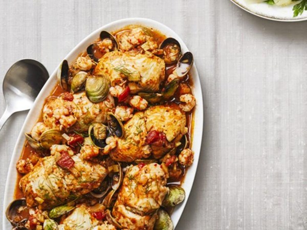 Crab-stuffed flounder rolls with shrimp and cockles