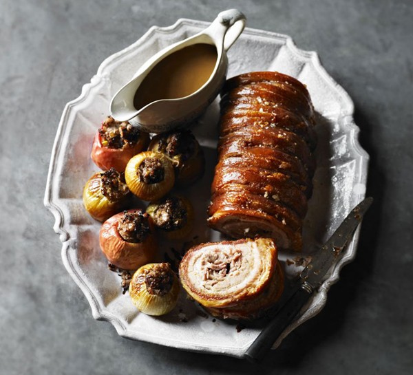 Crackle roast pork with sausage-stuffed apples & onions 