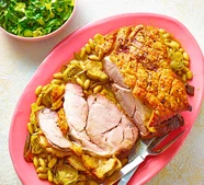 Crackling roast pork with beans, rosemary & artichokes
