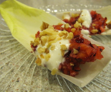 Cranberry and persimmon filled endive with tangy goat cheese dressing