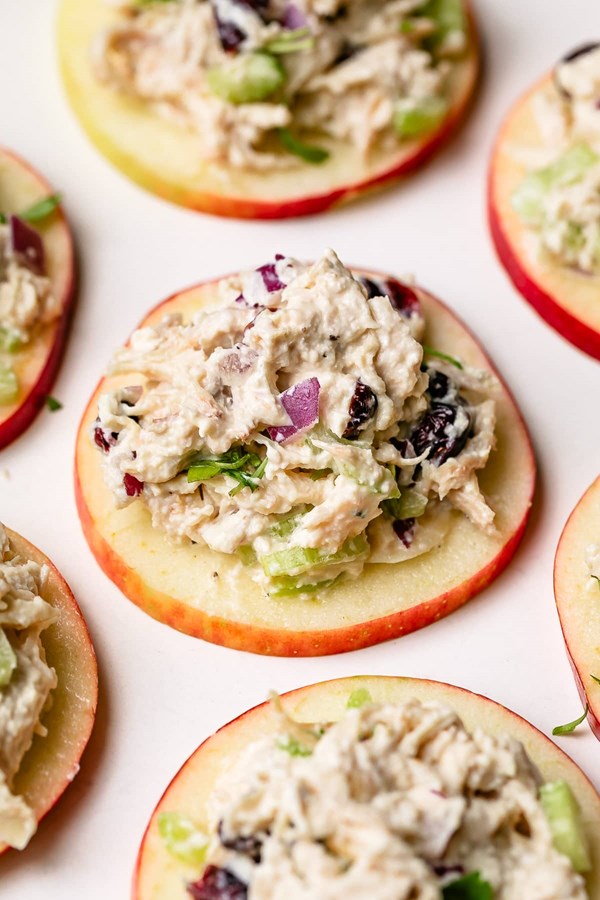Cranberry chicken salad on apple slices