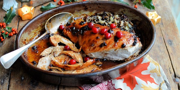 Cranberry-glazed roast turkey breast with wild rice stuffing