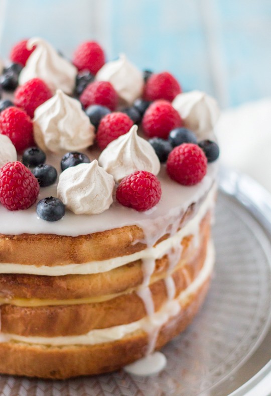 Cream & lemon curd layered sponge with berries & meringue