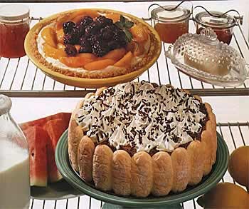 Cream cheese pie topped with peaches and blackberries