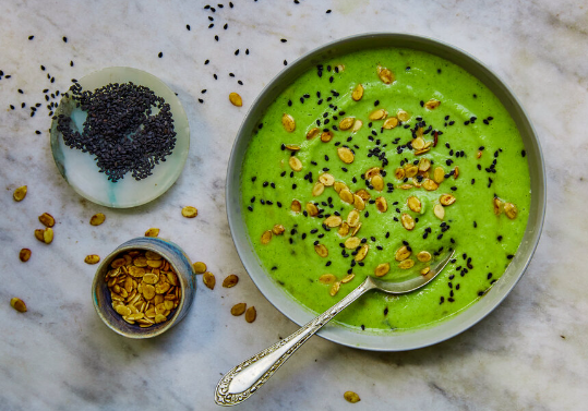Cream of broccoli soup with black sesame and watermelon seeds