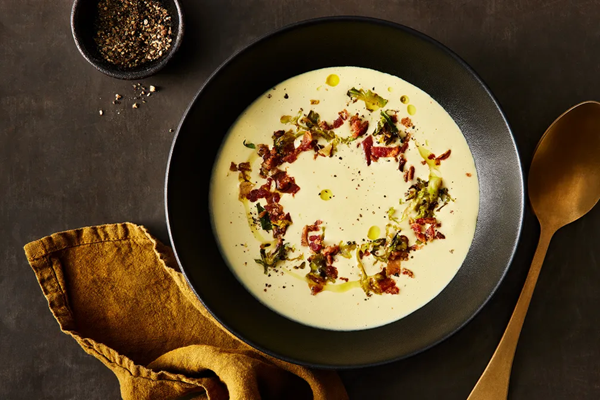 Cream of Brussels sprouts soup with crispy bacon