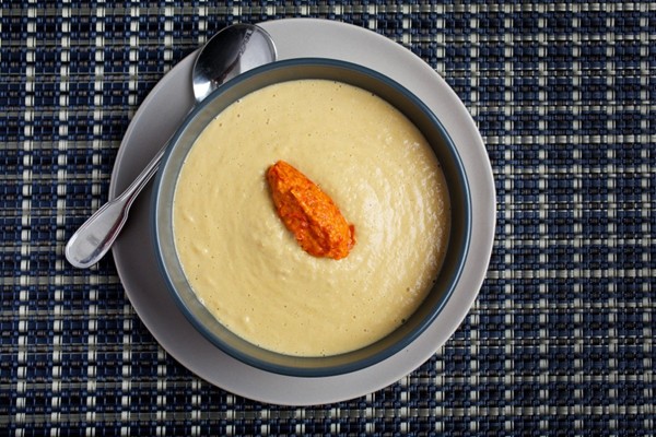 Cream of corn soup with red pepper sauce