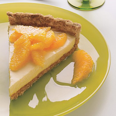 Cream tart with oranges, honey, and toasted-almond crust