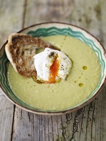 Creamy asparagus soup with a poached egg on toast