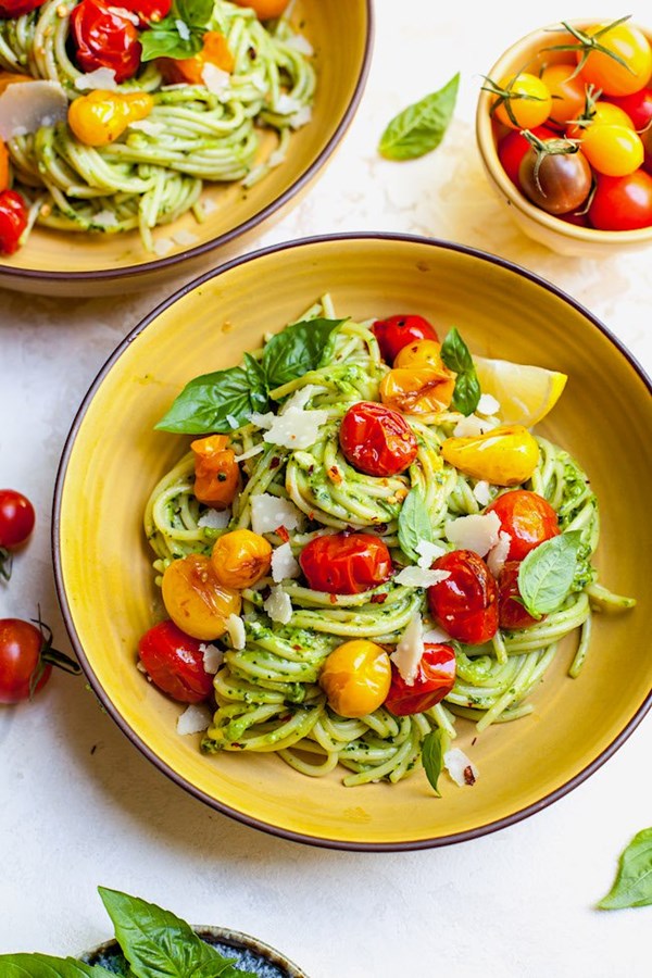 Creamy avocado pesto pasta with blistered tomatoes
