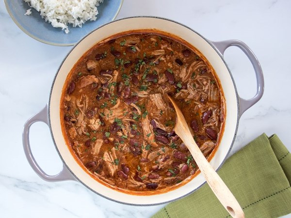 Creamy braised pork and bean stew with cinnamon, fennel, and onion